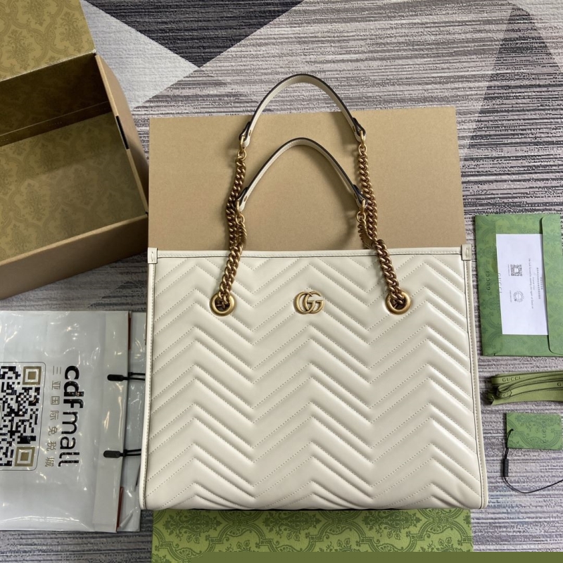 G*u*i shopping bags